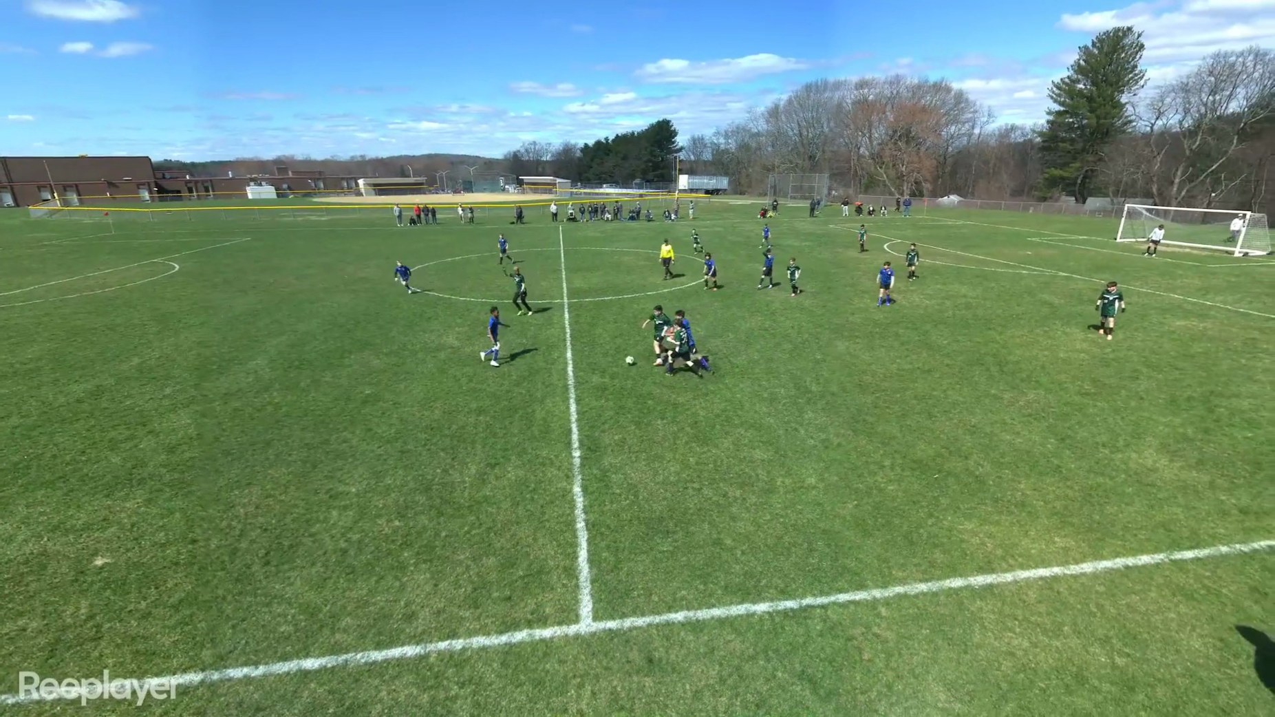Angled AI-camera still of a youth soccer match